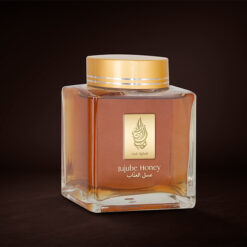 A 500gm bottle of Jujube honey from alghali with black backgroud